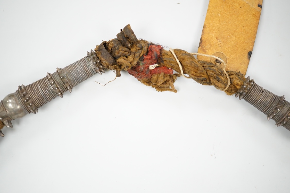 A Bedouin white metal and coral mounted necklace, from Oman, 58cm long